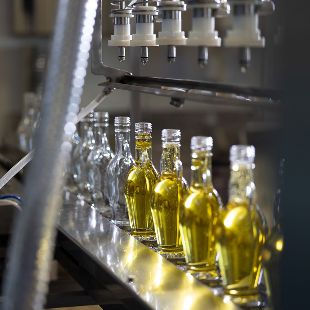 a row of bottles on a conveyor belt