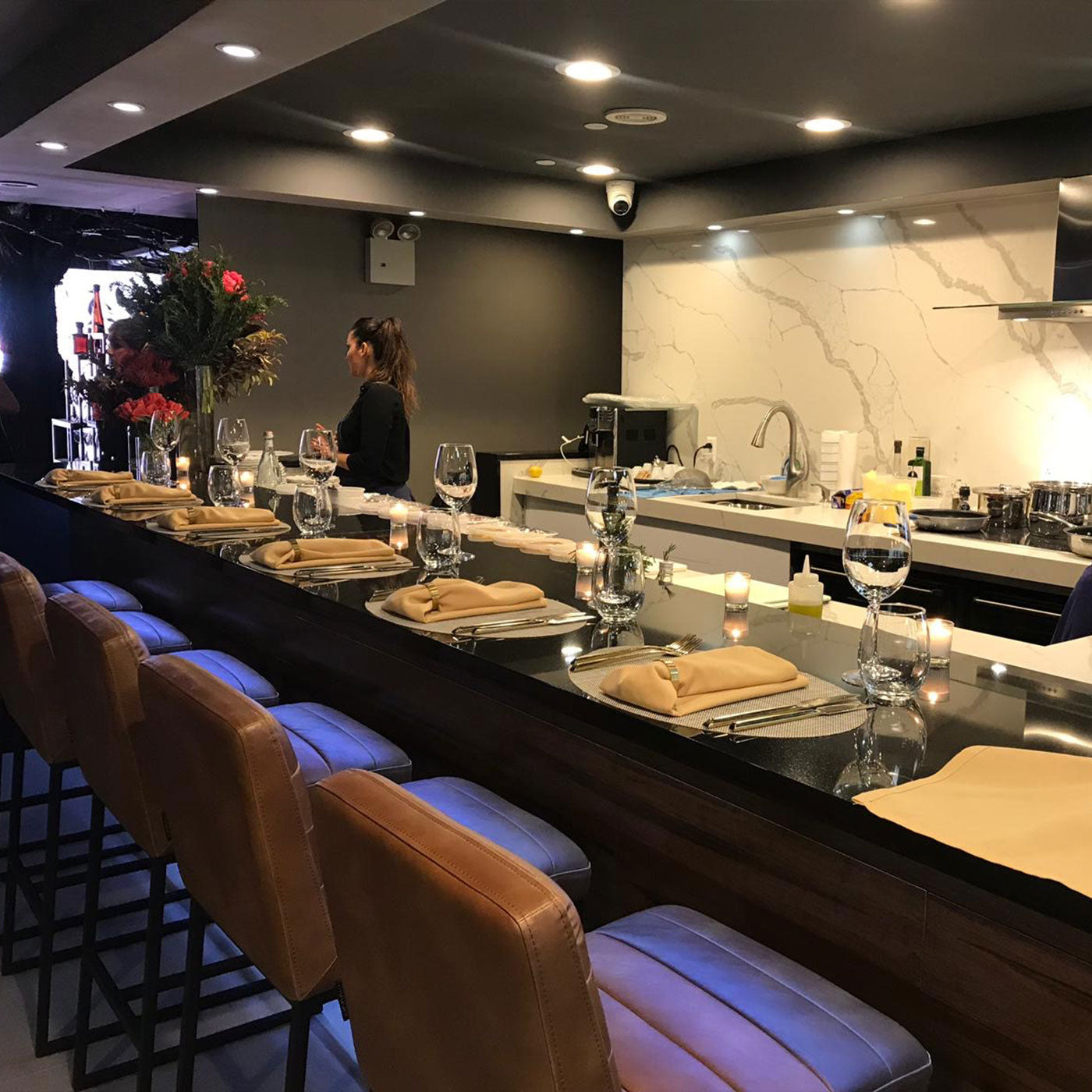 a bar with a counter and chairs