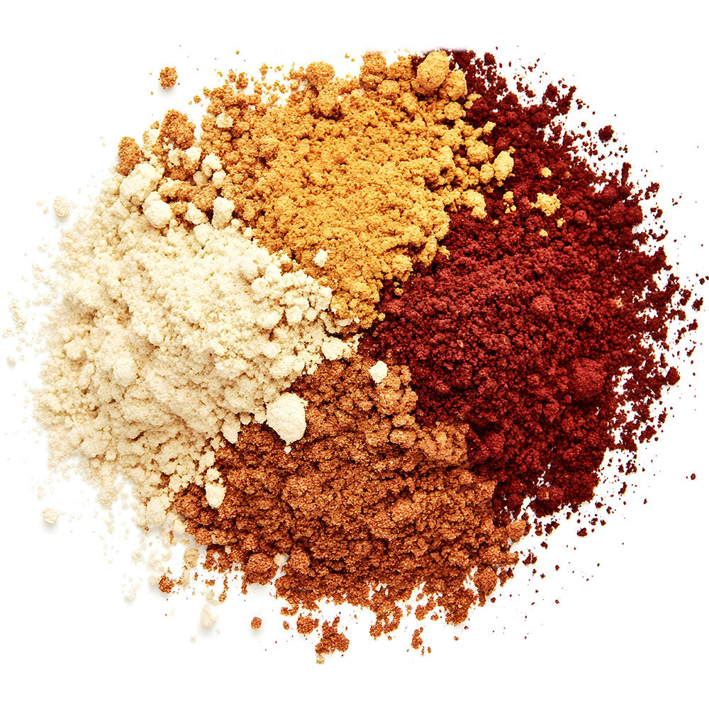 a pile of different colored powders