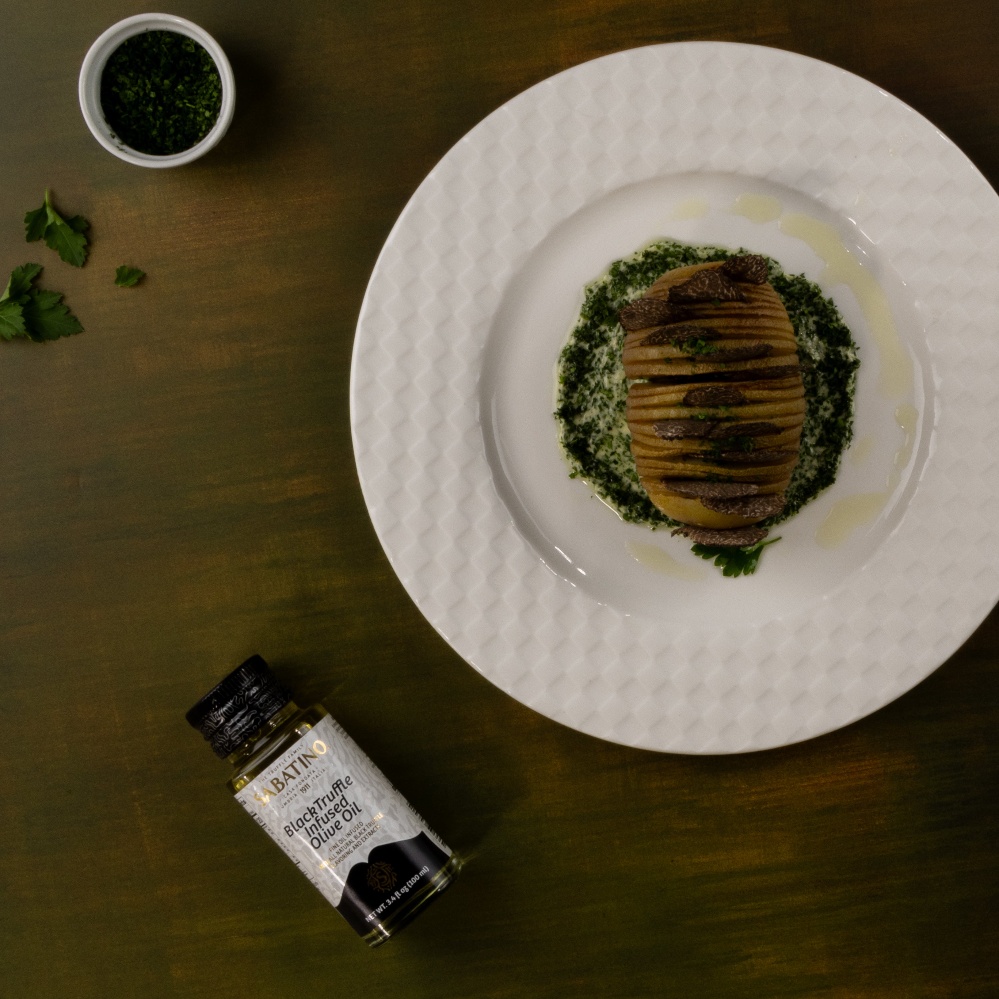 a plate of food and a small bottle of oil