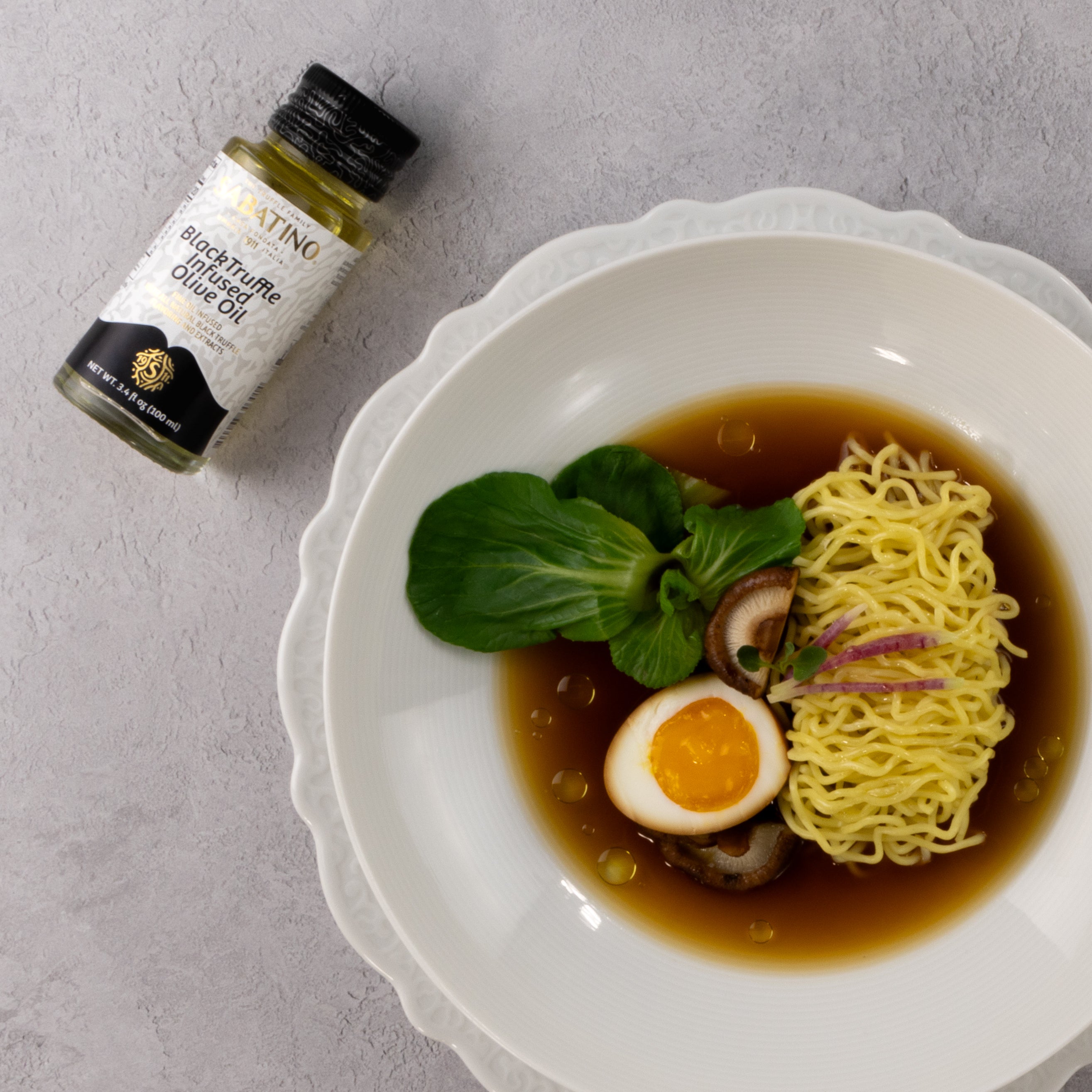 a bowl of ramen with an egg and vegetable in it