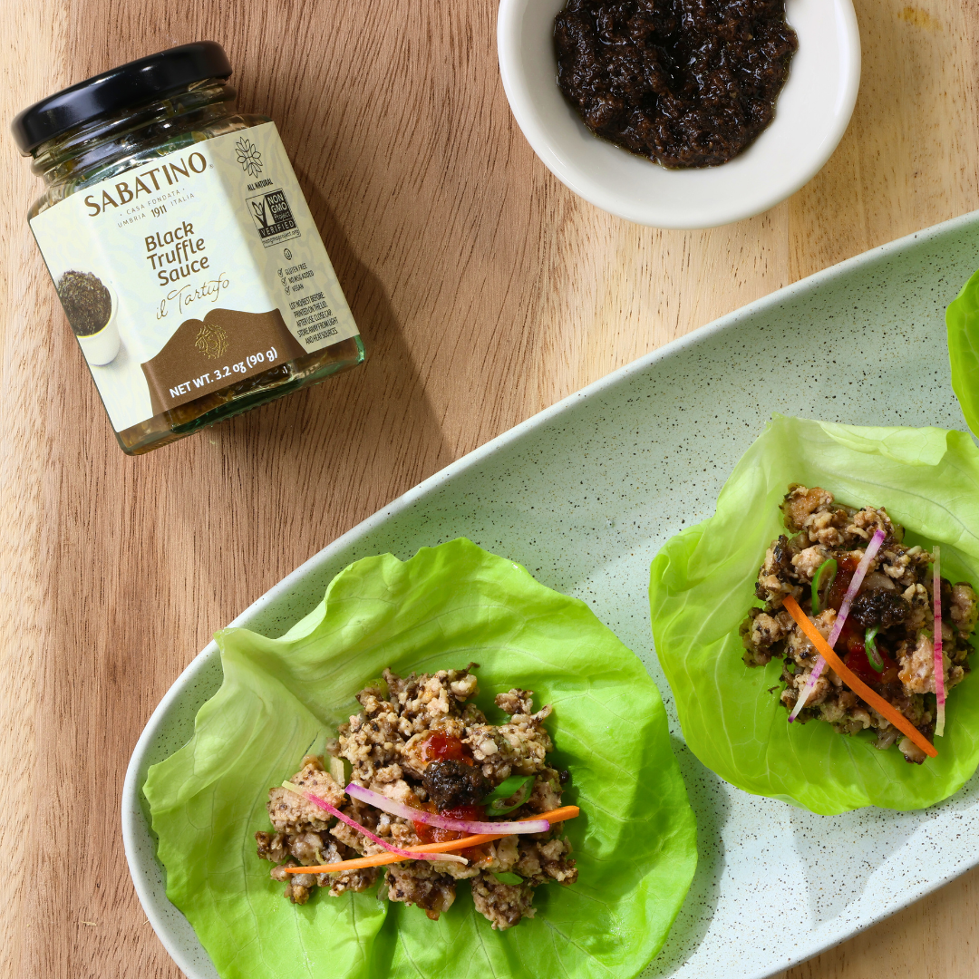food on a plate next to a jar