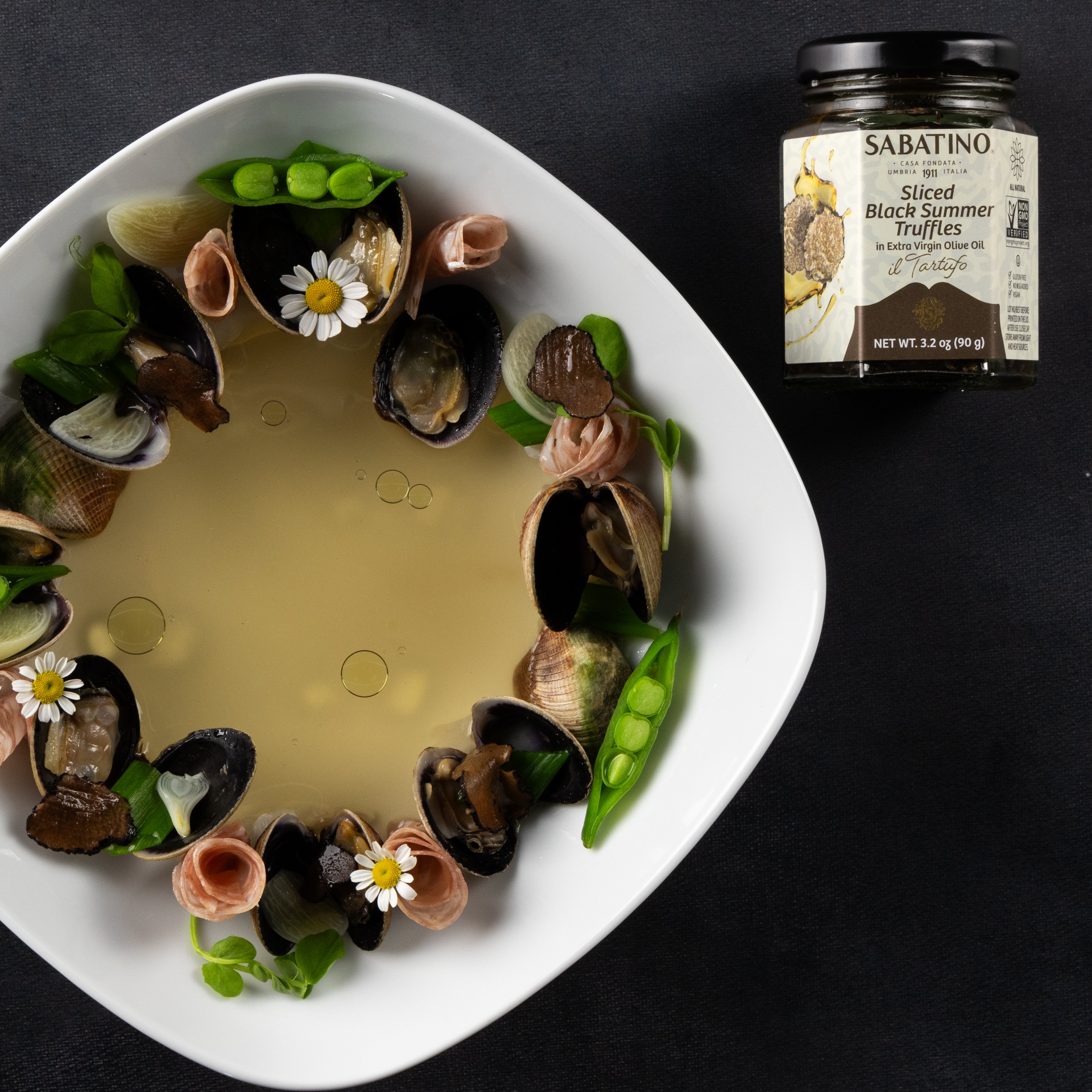 a bowl of food with a jar of liquid
