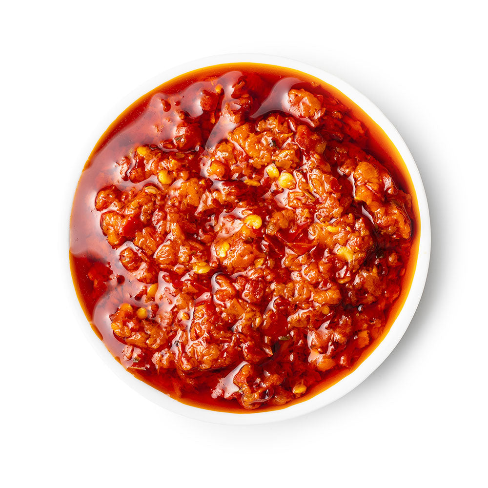 a bowl of chili sauce