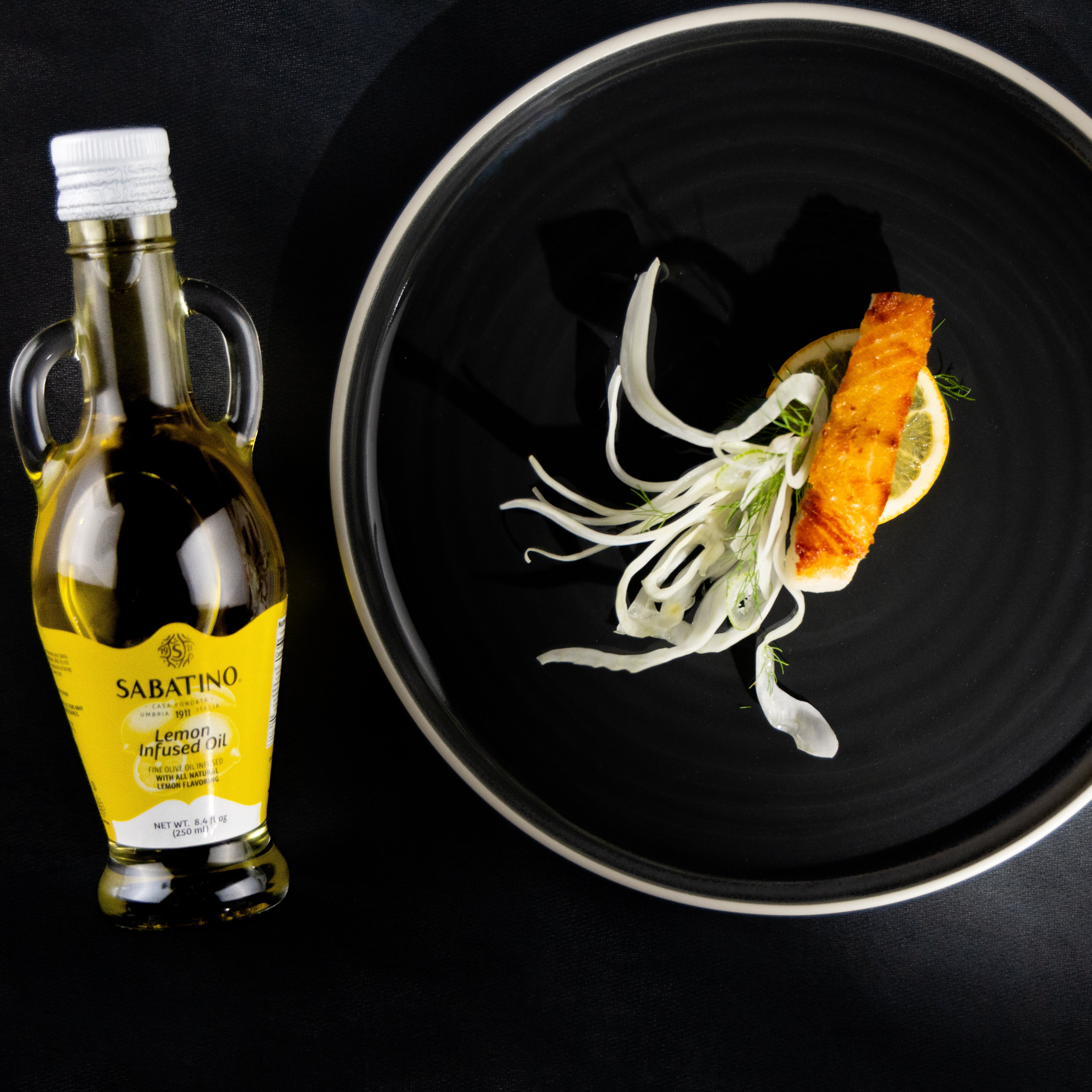 a plate of food and a bottle of oil