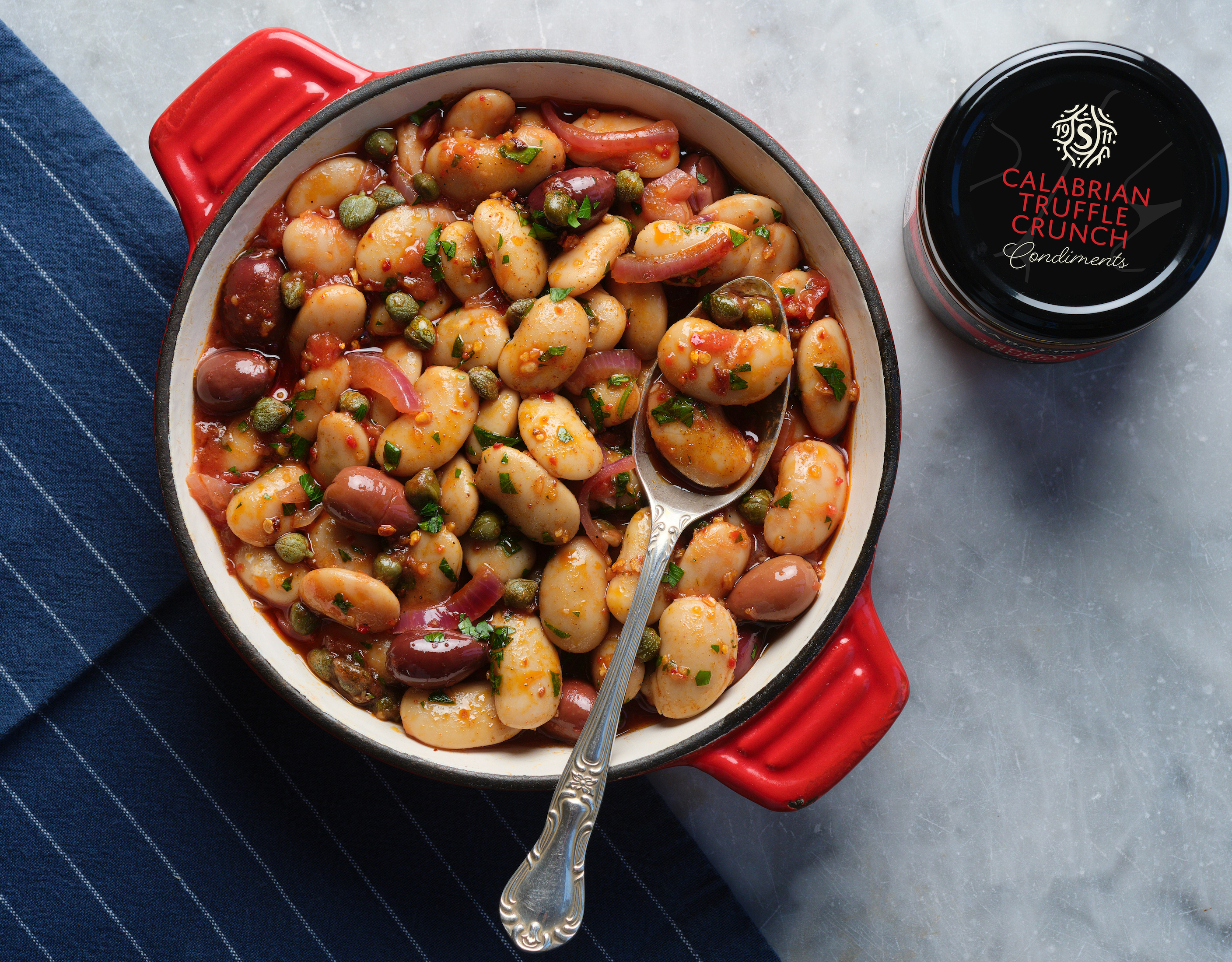 a bowl of beans with a spoon