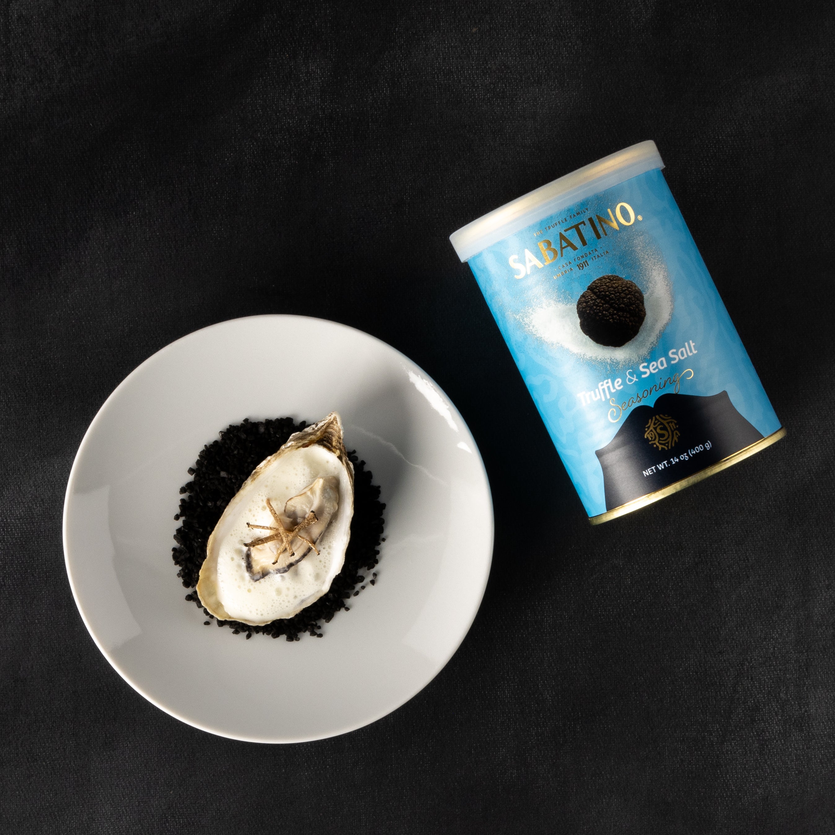 a plate of food and a can of salt