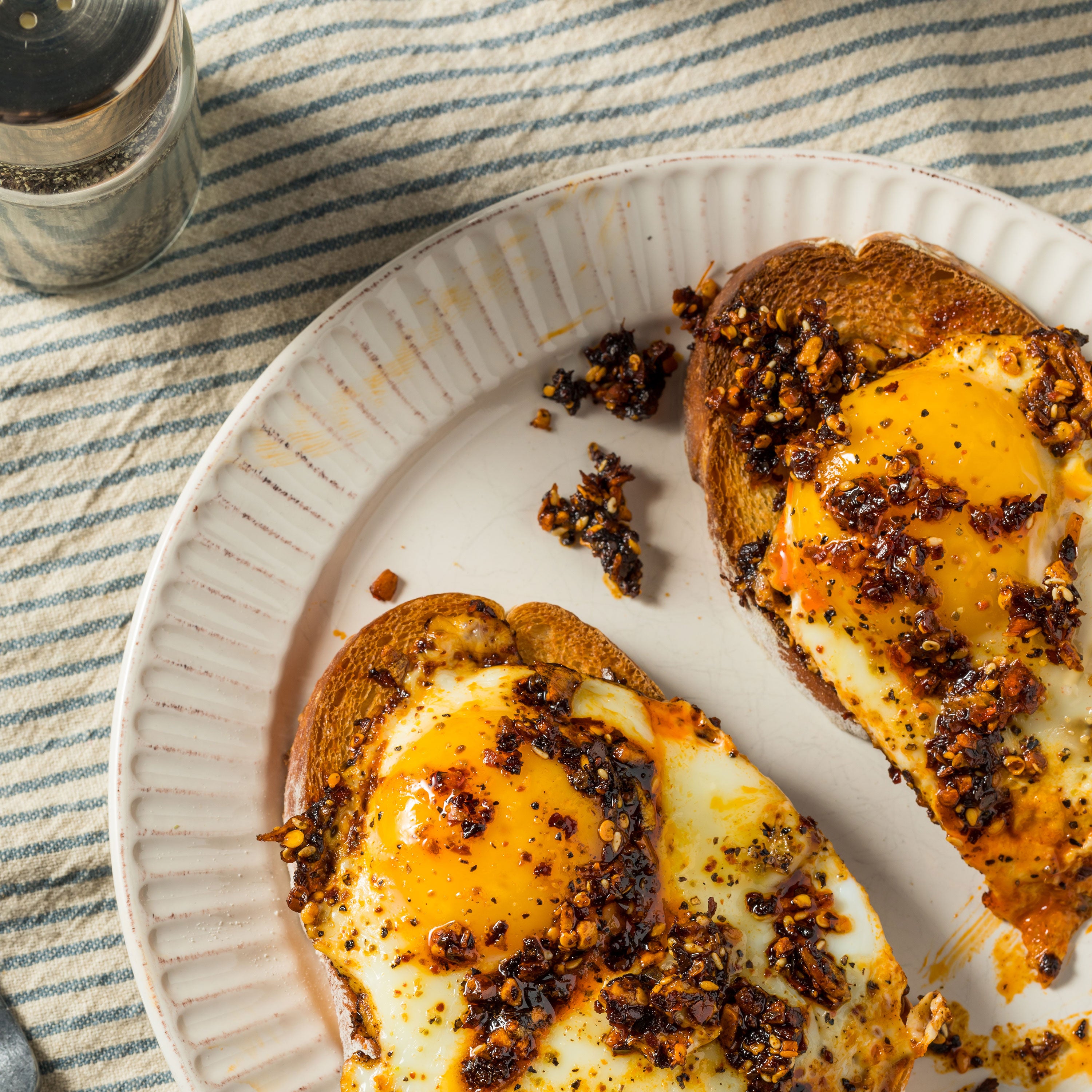a plate of food with a salt and pepper shaker